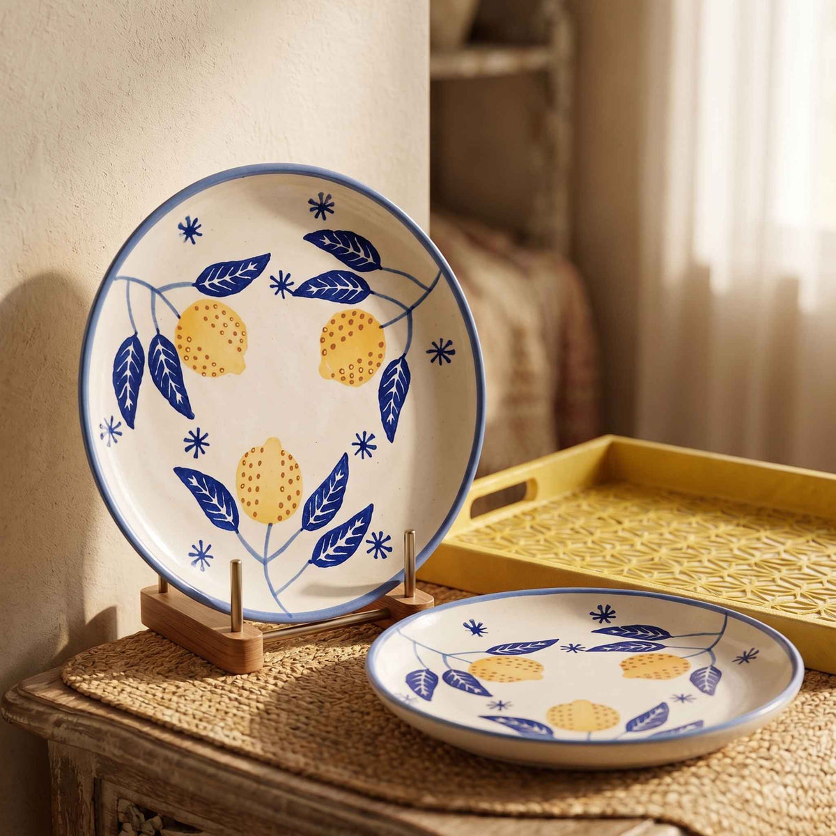 Botanical ceramic plate with yellow lemon-inspired flowers and blue leaf pattern
